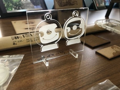 Laser engraving artwork with corporate identity.